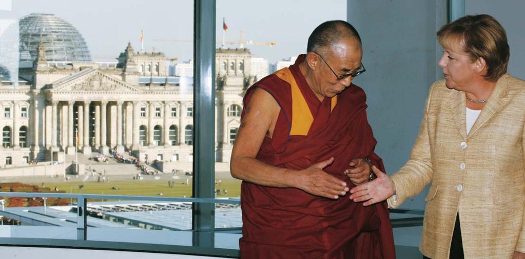 _Facing photo: President Bush giving the Dalai Lama an award previously given to Winston Churchill and Nelson Mandela.