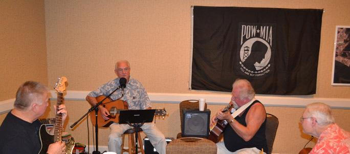 the reunion, while others at the near end listen to the band. Right is Dave Barlow and David Hassen.