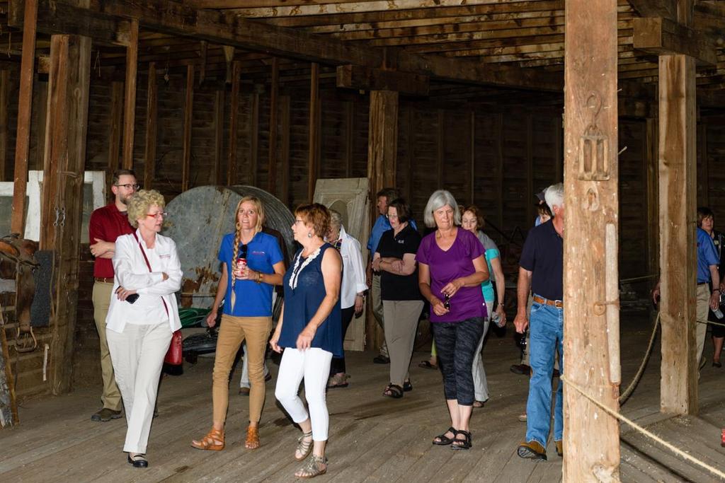 Liz gives a group of tourists a guided tour of the Starke Round Barn Do you have any hobbies or interests you d like to share?