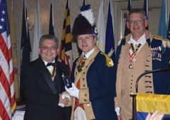 AWARD WINNERS NEW COMMANDER AND SILVER COLOR GUARD MEDAL RECIPIENT National Color Guard Commander, Joseph Dooley, presided over the transfer of command, by passing the sword, from John H, Franklin,