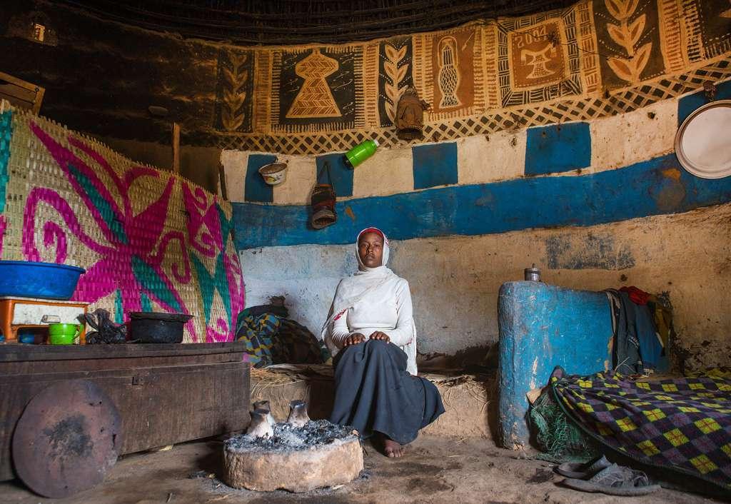 Above this woman, the main items that people use in the region: an injera basket (the