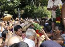 Ramanan and Ashram devotees gathered at the front gate for darshan, as the Lord