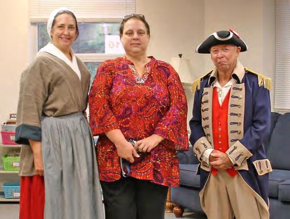 Calhoun County Elementary and Junior High School along with Colonial Williamsburg re-enactor Darci Tucker (left) and Deann Koster