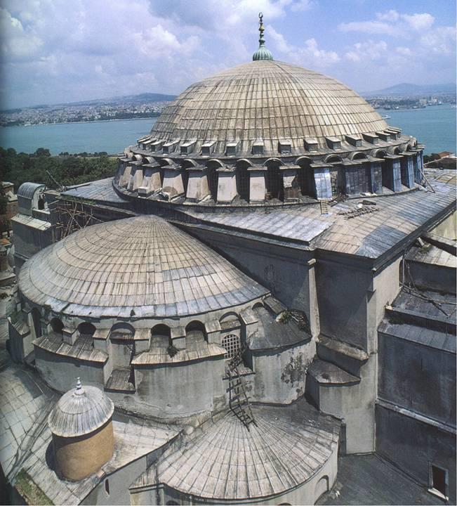 At Hagia Sophia, two opposing arches on the central square open into semi domes, each pierced by 3 smaller radial semidomes.