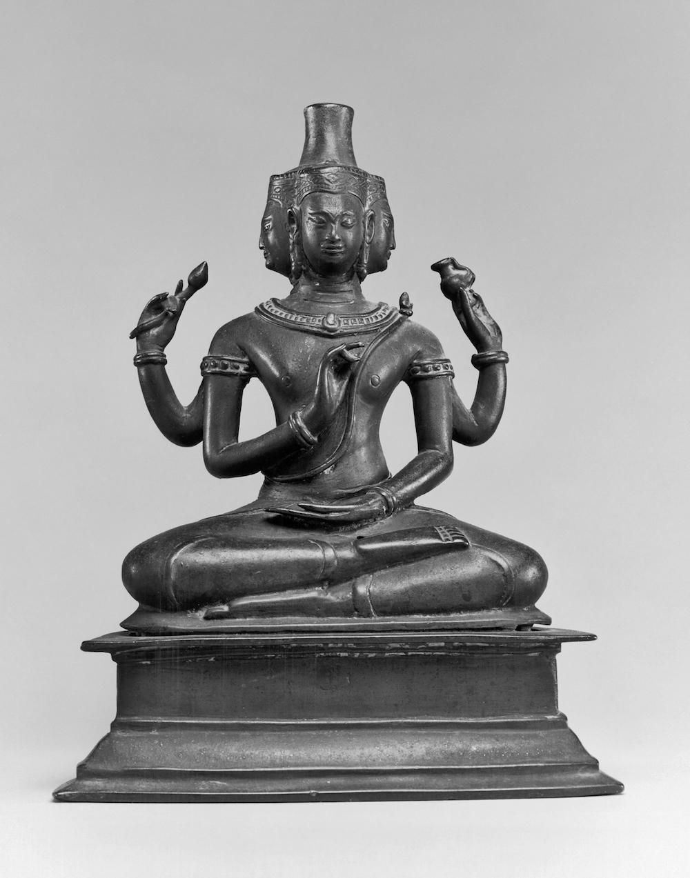 Brahma is often shown dressed in red and with four heads. The four heads stand for the four Vedas. The Vedas are holy books of Hinduism. Brahma is also shown with four arms.