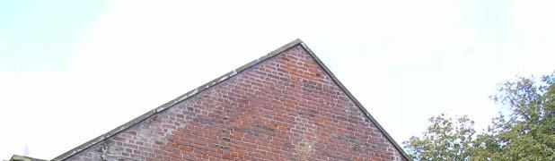 Further east is a two-light cusped Y -traceried window with an arch formed of brick directly above.